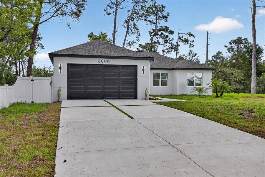 Front exterior of a new home in , Spring Hill, FL, highlighting curb appeal (Image 29).