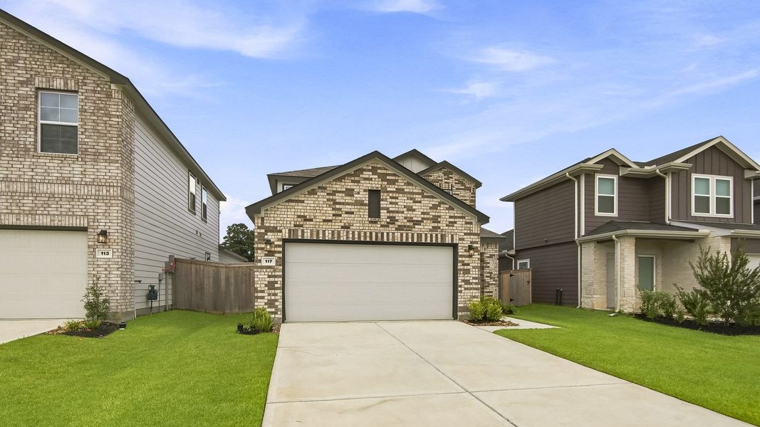 Front exterior of a new home in Maple Woods, Hockley, TX, highlighting curb appeal (Image 19). Front exterior of a new home in Maple Woods, Hockley, TX, highlighting curb appeal (Image 19).