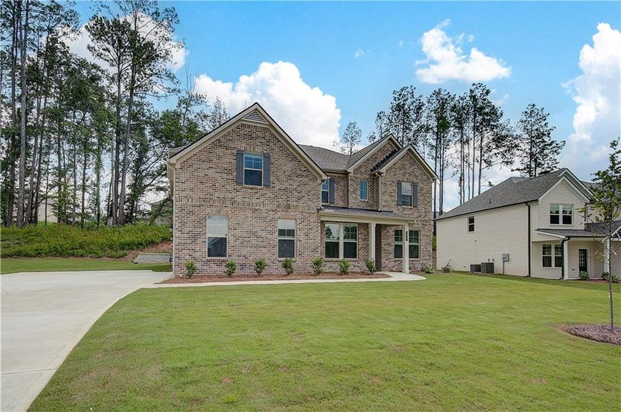 Front exterior of a new home in Trinity Park, McDonough, GA, highlighting curb appeal (Image 17).