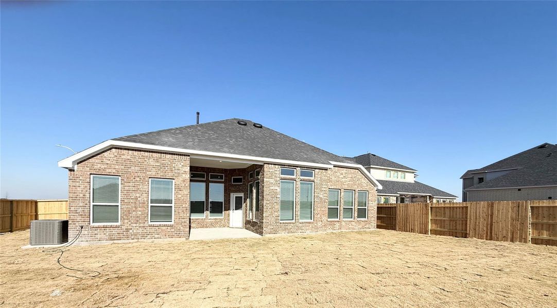 Exterior details and patio area of a home in , Iowa Colony (Image 4).