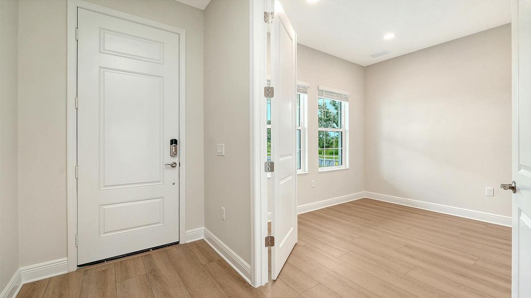 Spacious, unfurnished interior of a new home in Wildleaf Real Estate and Homes for Sale in Parrish, FL - Neal Communities, Parrish (Image 26).