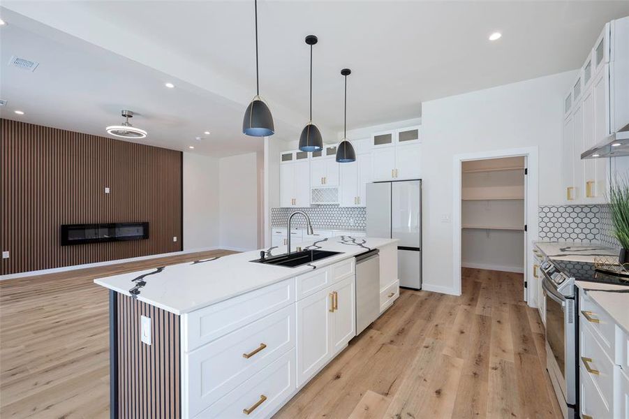 Dining area with a wealth of natural light and light hardwood / wood-style flooring