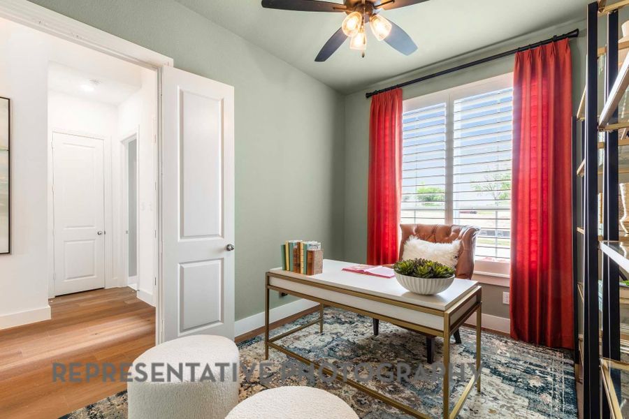 Office space with baseboards, ceiling fan, and wood finished floors Office space with baseboards, ceiling fan, and wood finished floors