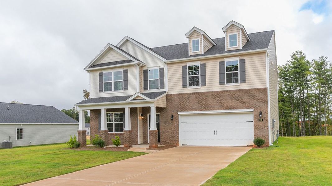 Front exterior of a new home in Forest Creek, Winston-Salem, NC, highlighting curb appeal (Image 1).