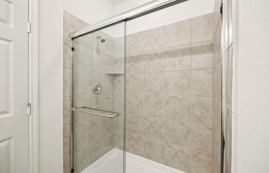 Owner's bath featuring a walk-in shower Owner's bath featuring a walk-in shower