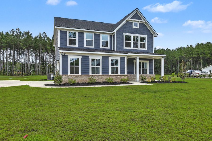 Front exterior of a new home in , Ridgeville, SC, highlighting curb appeal (Image 1). Front exterior of a new home in , Ridgeville, SC, highlighting curb appeal (Image 1).