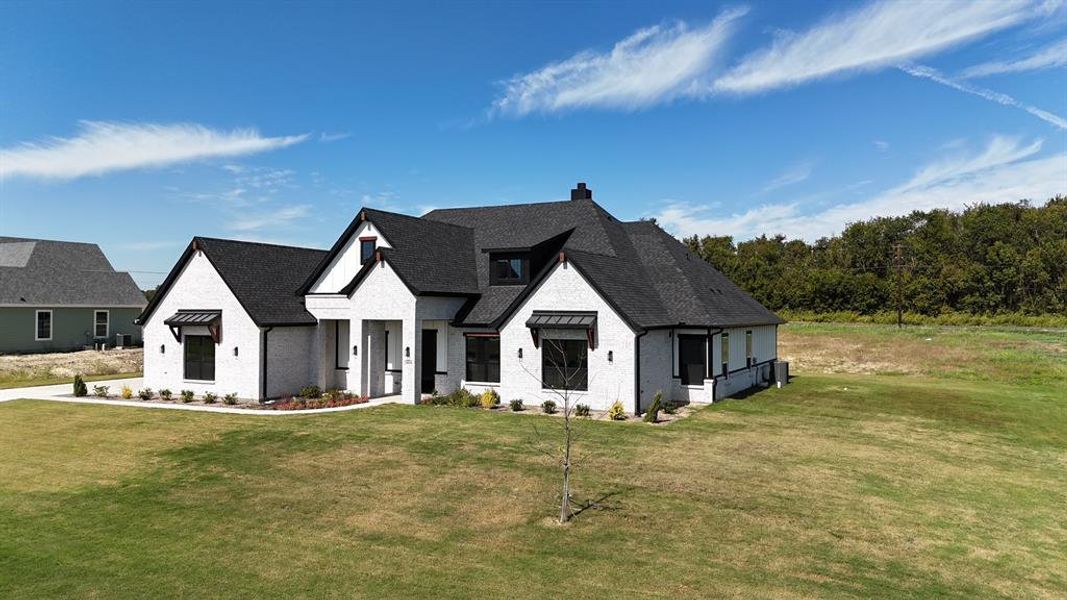 Front exterior of a new home in Capitol Hill, Anna, TX, highlighting curb appeal (Image 2). Front exterior of a new home in Capitol Hill, Anna, TX, highlighting curb appeal (Image 2).