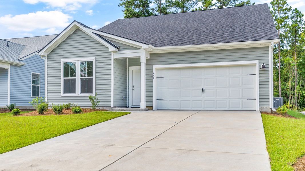 Representative exterior photo of a completed home built from the Chelsea by DRB Homes in Bluffs at Sun Colony, Longs, SC (Image 22).