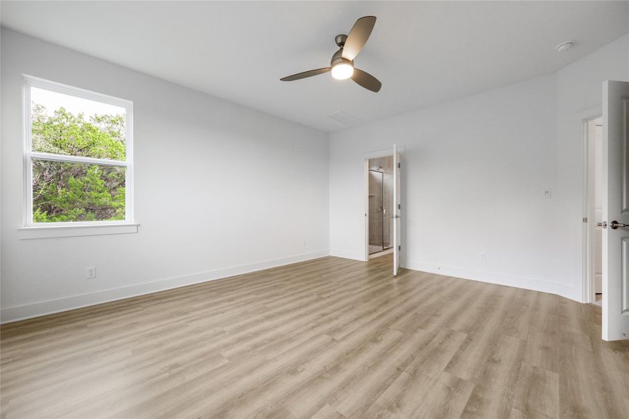 Primary bedroom leading to the bathroom.