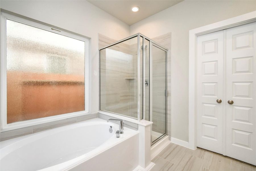 Escape to a spa-like oasis in this primary bathroom. Sample photo of completed home with similar floor plan. Actual colors and selections may vary. Escape to a spa-like oasis in this primary bathroom. Sample photo of completed home with similar floor plan. Actual colors and selections may vary.