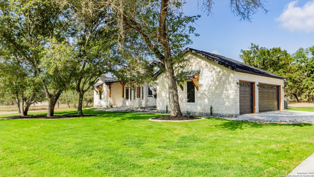 Front exterior of a new home in , La Vernia, TX, highlighting curb appeal (Image 2).