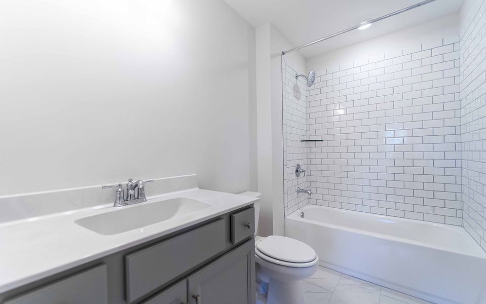 Furnished interior view inside a new home in Aden Woods, Fairview (Image 12).