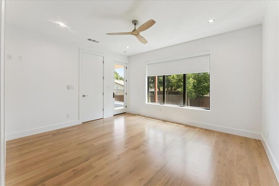 Empty room featuring light wood-type flooring, recessed lighting, and ceiling fan