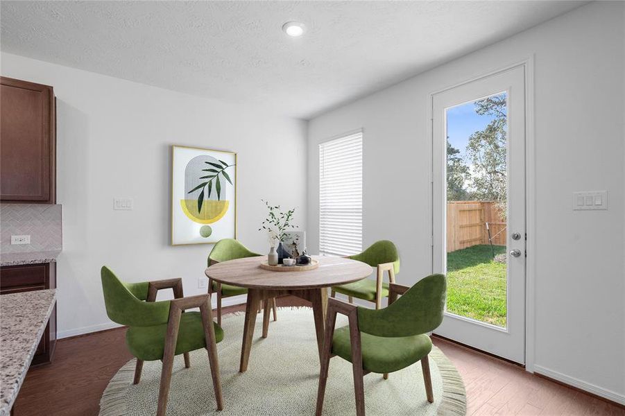 Make memories gathered around the table with your family and friends! This dining room features high ceilings, a large window with privacy blinds and recessed lighting!