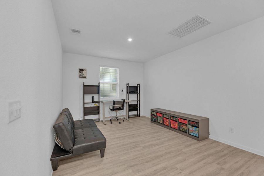 Furnished interior view inside a new home in Seasons at Carillon, Manor (Image 27).