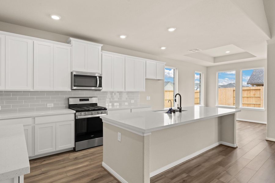 Kitchen and breakfast nook. Note: Sample product photo - actual exterior and interior selections may vary by homesite