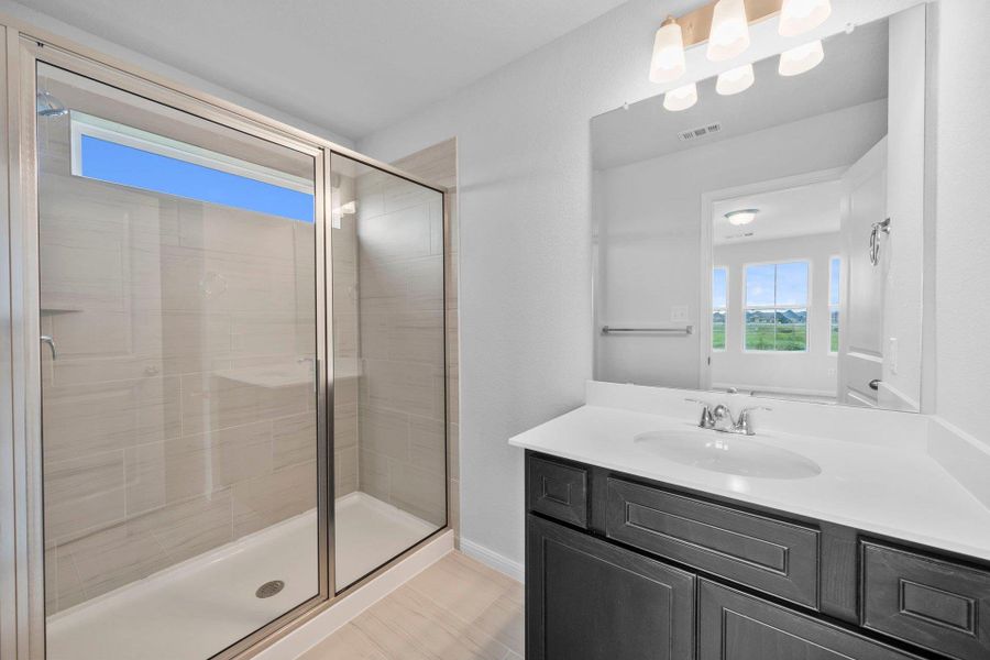 Primary Bath retreat with dual vanities & walk-in shower Primary Bath retreat with dual vanities & walk-in shower