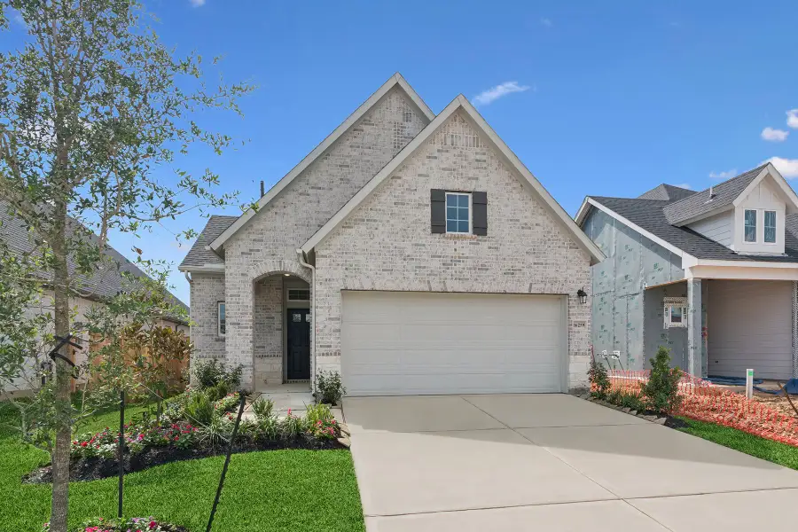 Front exterior of a new home in The Grand Prairie 40’, Hockley, TX, highlighting curb appeal (Image 2).