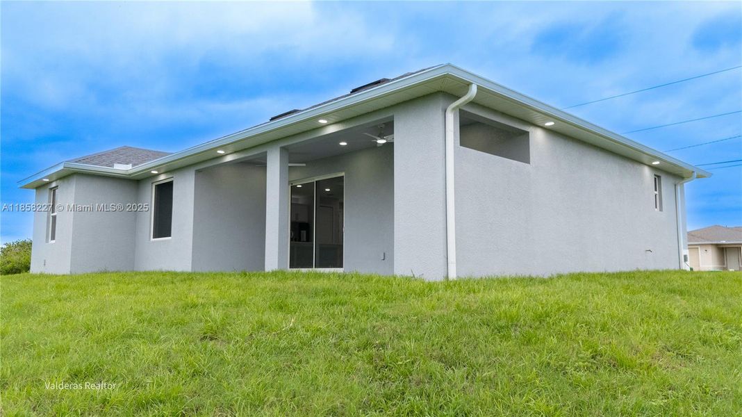Front exterior of a new home in , Lehigh Acres, FL, highlighting curb appeal (Image 24).