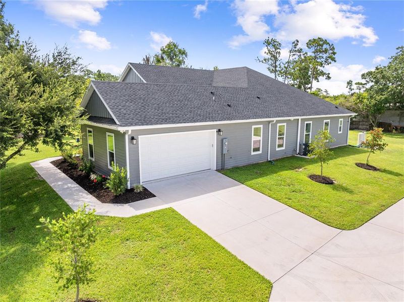 Front exterior of a new home in , St. Cloud, FL, highlighting curb appeal (Image 23).