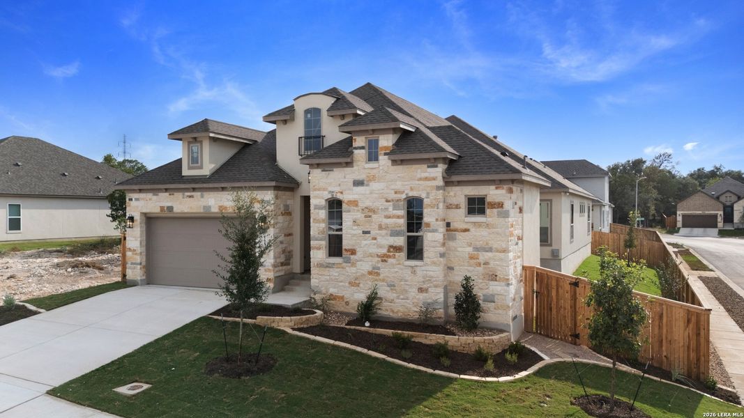 Front exterior of a new home in Cibolo Crossing, Universal City, TX, highlighting curb appeal (Image 22).