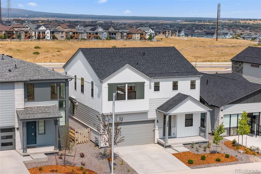 Front exterior of a new home in Harmony at Sterling Ranch, Littleton, CO, highlighting curb appeal (Image 22).
