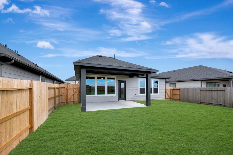 Exterior details and patio area of a home in Mason Woods, Cypress (Image 4).