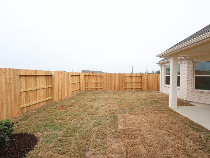 Exterior details and patio area of a home in Wildrye, Waller (Image 3).