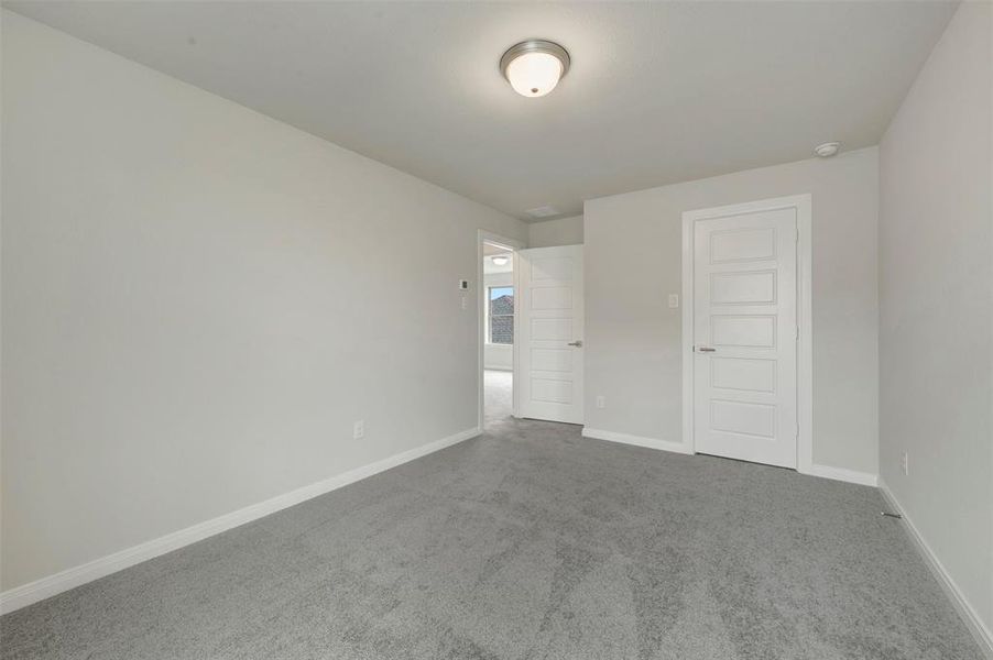 Neutral gray carpet flooring complementing light-toned walls