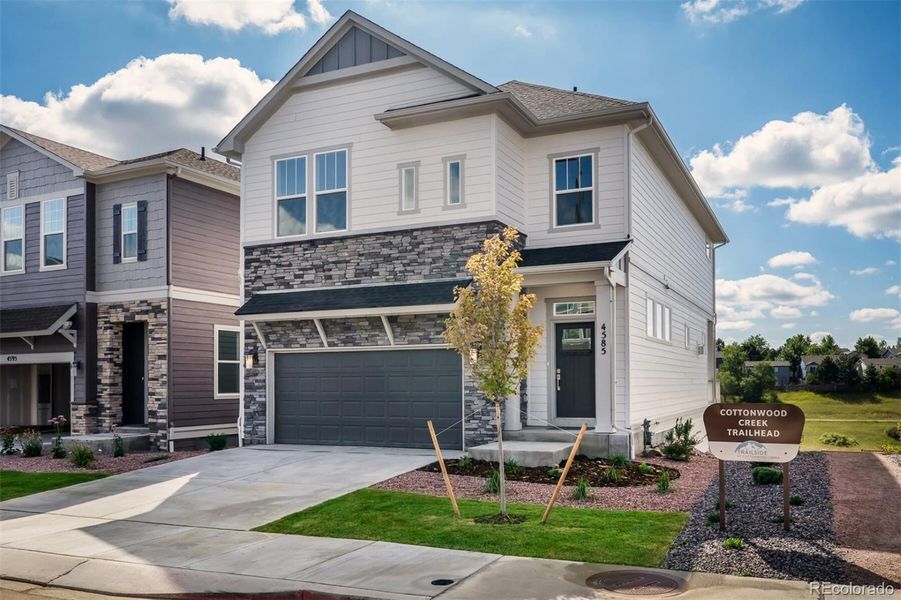 Front exterior of a new home in Trailside at Cottonwood Creek, Colorado Springs, CO, highlighting curb appeal (Image 2).