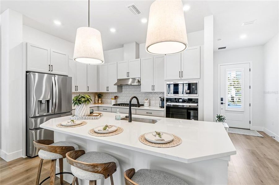 Furnished interior view inside a new home in Emerald Landing at Waterside at Lakewood Ranch – Cottage Series, Sarasota (Image 8). Furnished interior view inside a new home in Emerald Landing at Waterside at Lakewood Ranch – Cottage Series, Sarasota (Image 8).