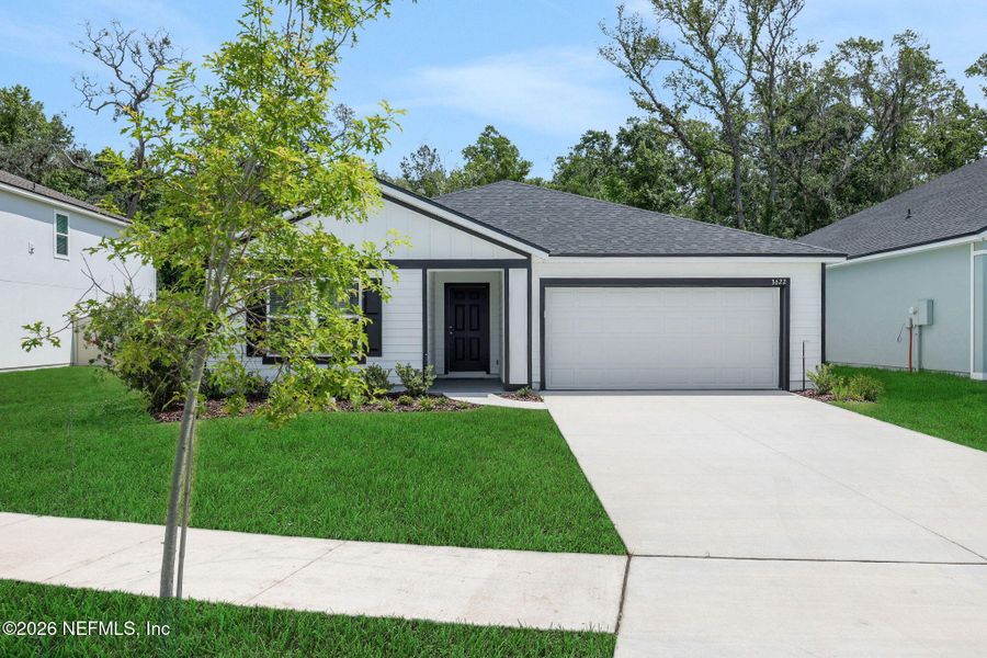 Front exterior of a new home in Wilford Oaks, Orange Park, FL, highlighting curb appeal (Image 25). Front exterior of a new home in Wilford Oaks, Orange Park, FL, highlighting curb appeal (Image 25).