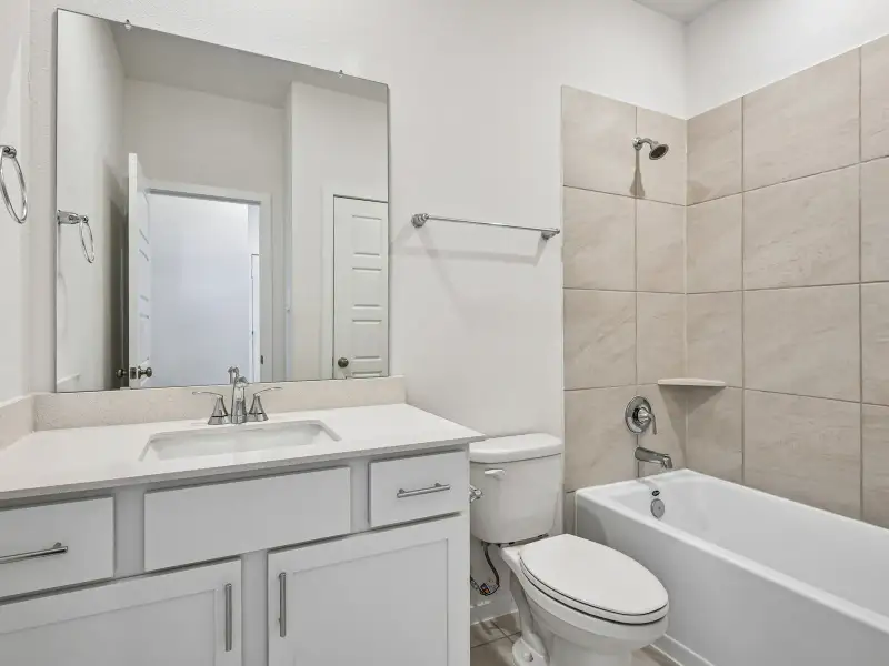 Furnished interior view inside a new home in Riviera Pines - Premier Series, Huffman (Image 9).