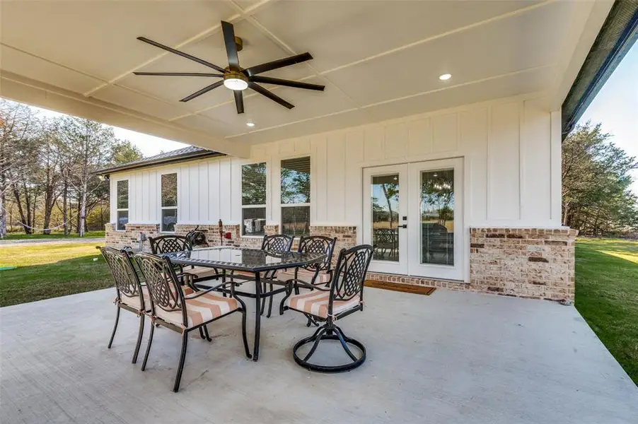 View of patio / terrace with a ceiling fan and outdoor dining space