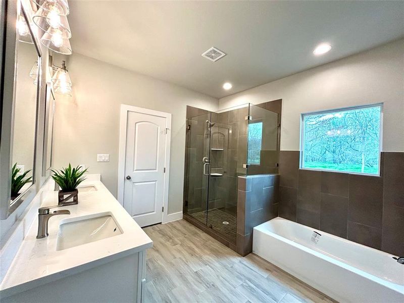 Separate shower/tub in the primary bathroom.