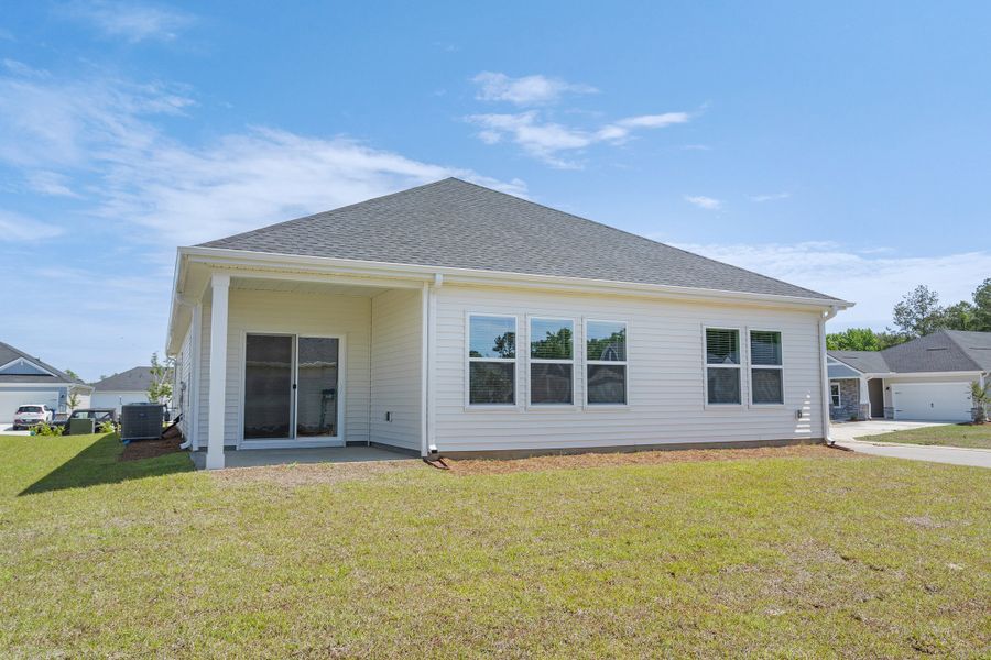 Exterior details and patio area of a home in Palmetto Place, Longs (Image 3).