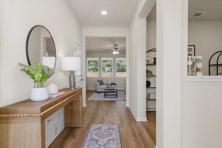 Upon entry, you'll immediately be drawn to the view of the lush greenery behind the home.