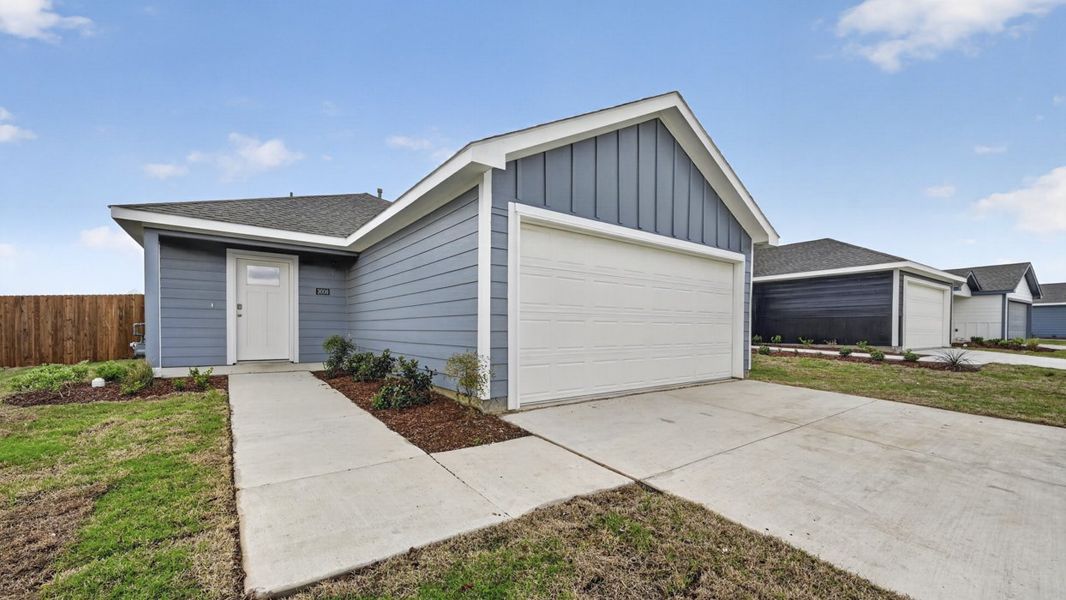 Representative exterior photo of a completed home built from the Atlanta by D.R. Horton in The Hills of Sherman, Sherman, TX (Image 19).