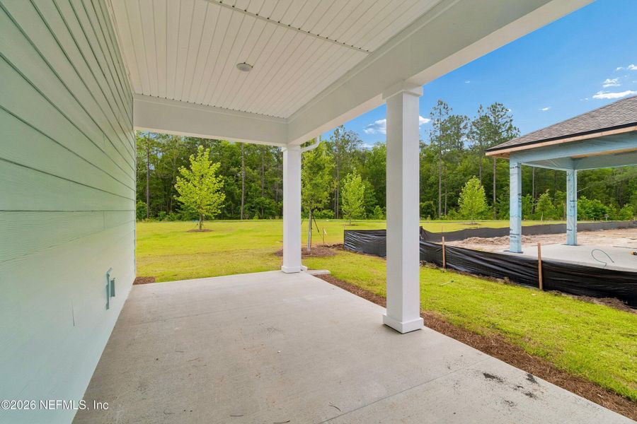 Exterior details and patio area of a home in Westerly Park at Wildlight – Villa Collection, Yulee (Image 18). Exterior details and patio area of a home in Westerly Park at Wildlight – Villa Collection, Yulee (Image 18).