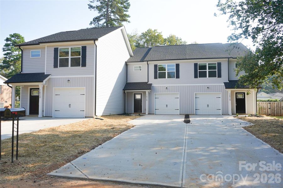 Front exterior of a new home in , Charlotte, NC, highlighting curb appeal (Image 26).
