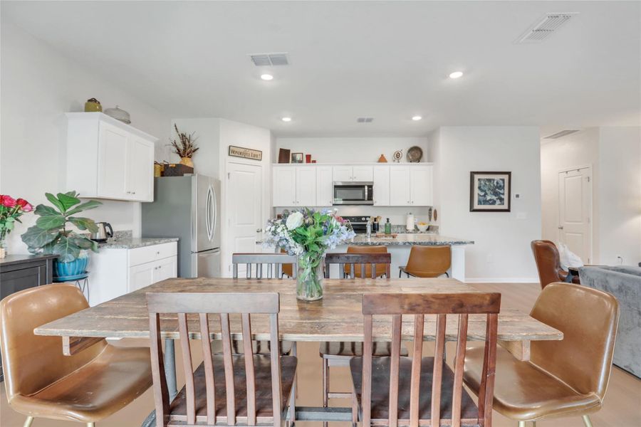 Dining room featuring recessed lighting and light wood finished floors