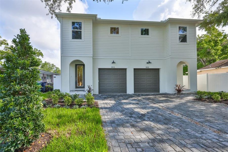 Front exterior of a new home in , Tampa, FL, highlighting curb appeal (Image 1). Front exterior of a new home in , Tampa, FL, highlighting curb appeal (Image 1).
