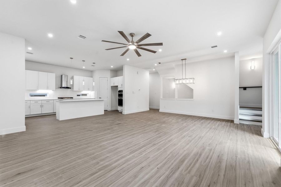 Generous dining area with modern pendant lighting and an open connection to the surrounding living spaces.