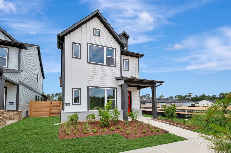Front exterior of a new home in Two Step Farm - Cottages Row Collection, Montgomery, TX, highlighting curb appeal (Image 25).
