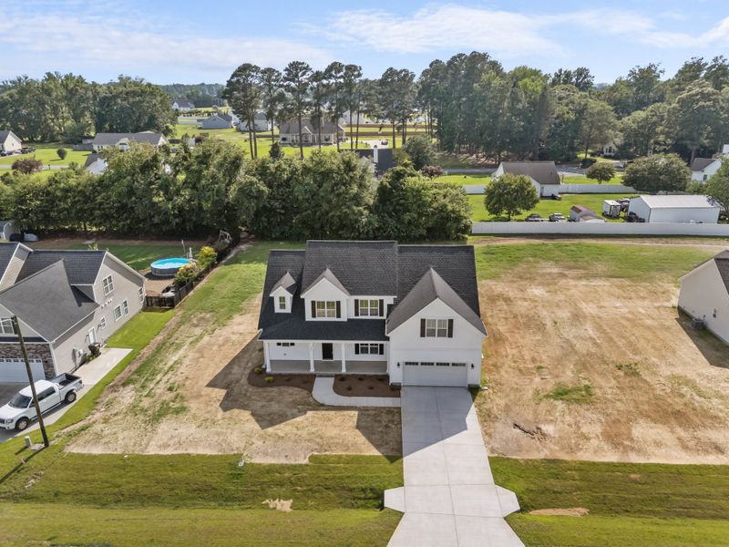 Representative exterior photo of a completed home built from the Albemarle by Bill Clark Homes in Kensington at Paramore, Winterville, NC (Image 35).