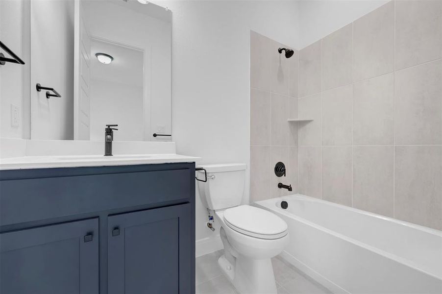 Bathroom with vanity and  shower combination