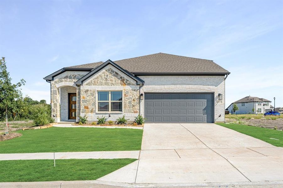 Front exterior of a new home in Bear Creek Elements, Lavon, TX, highlighting curb appeal (Image 25).