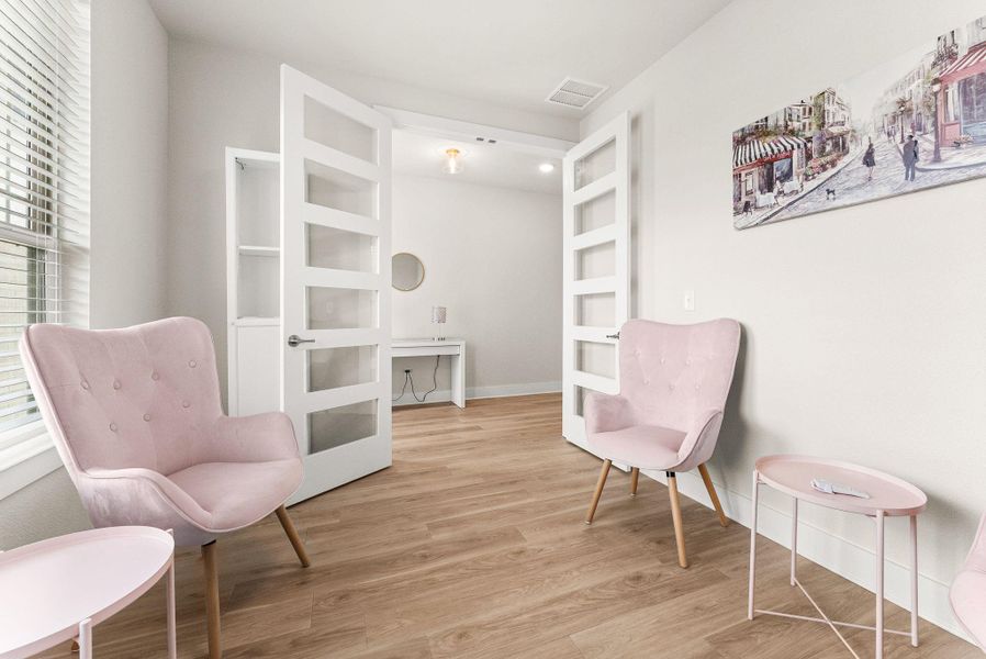 The office has double doors with glass insets.