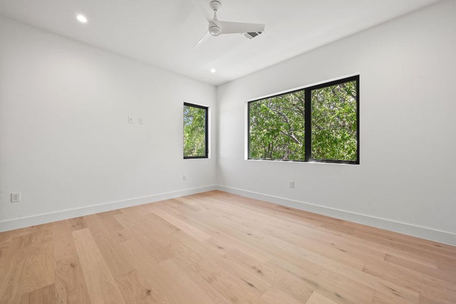 Unfurnished room featuring light wood-style floors, recessed lighting, and ceiling fan