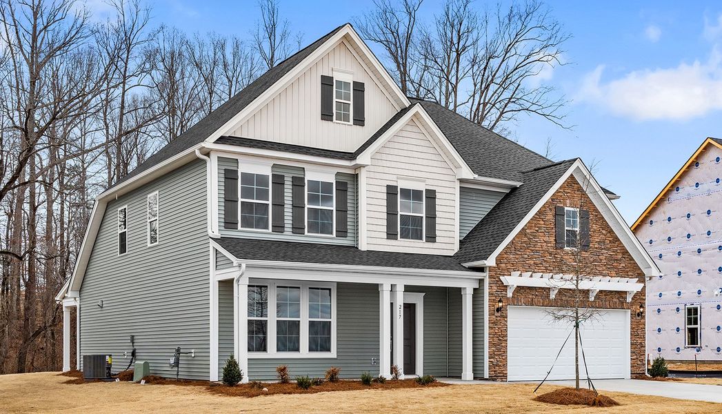 Front exterior of a new home in Fieldstone, Lexington, NC, highlighting curb appeal (Image 22).